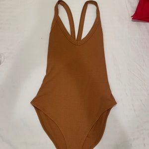 Crossed back body suit